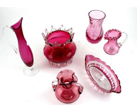 A group of six pieces of early 20th century and later cranberry and cranberry-coloured glassware to include a squat ovoid vas