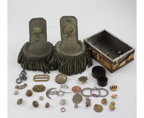 A pair of officer's epaulettes of the American Civil War Southern Confederate Army and a quantity of military buttons and cap