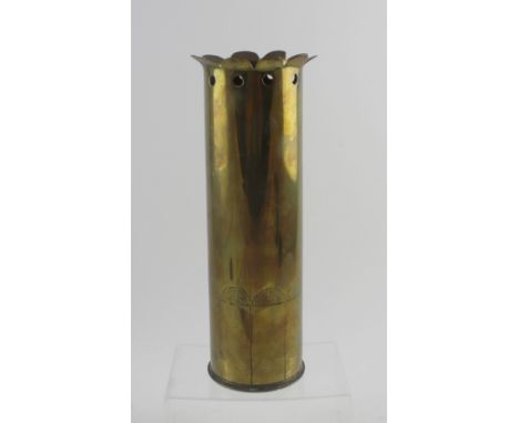 A trench art shell vase with pierced frill edge top and lower engraving, the base of the shell marked '15th December 1916', h