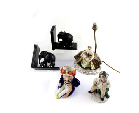 An early 20th century Capodimonte lamp with ceramic base of young woman in period costume reading a journal, signed to base, 