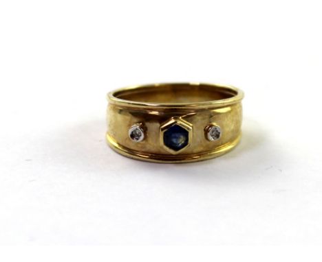 A 9ct yellow gold ladies' dress ring set with central sapphire and two small diamonds, size O, approx 4.2g.