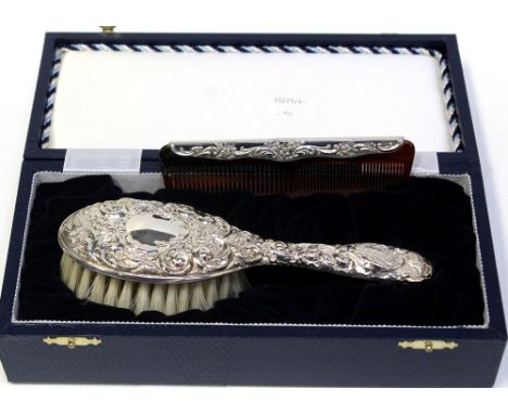 A cased Elizabeth II hallmarked silver millennium child's brush and comb set, B &amp; Co, Birmingham 2000.