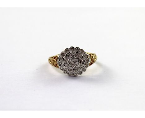 A 9ct yellow gold ladies' dress ring, floral-set with pavé diamonds and Celtic design to shoulders, size O, approx 2.6g.