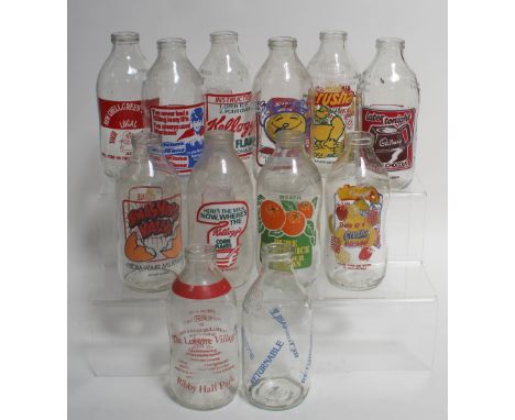 Over twenty vintage advertising milk bottles to include Kellogg's Corn Flakes, Crusha Milkshake, Smashing Value, Cadbury's La