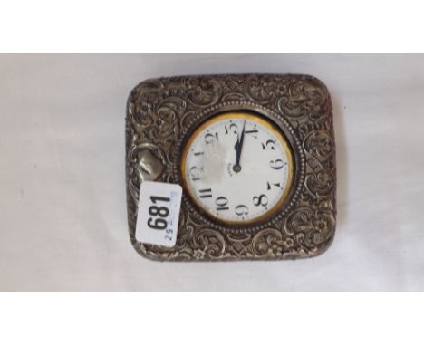 Eight day travelling clock contained in an embossed silver case  4” high – B’ham1899       
