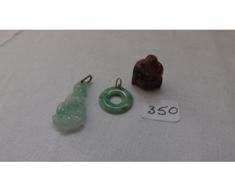 Jade pendants and a Buddha      