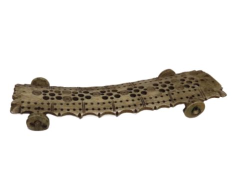 AN EARLY 19TH CENTURY NAPOLEONIC PRISONER-OF-WAR BONE CRIBBAGE BOARD
the bone with fretwork with pinned wheels underneath -- 