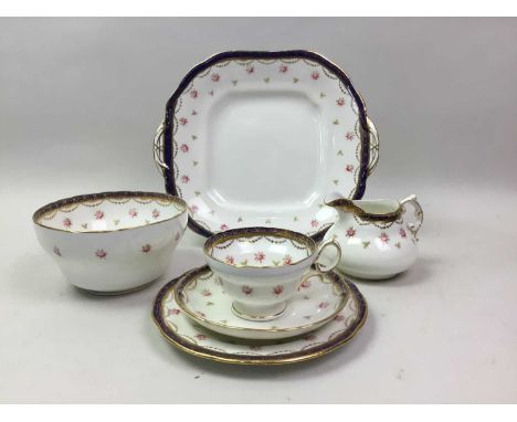 HAMMERSLEY & CO TEA SERVICE decorated with pink roses on a white ground and with blue and gilt bordersGood to fair. Wear as p