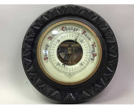 VICTORIAN OAK BAROMETER with carved decoration33cm diameter 