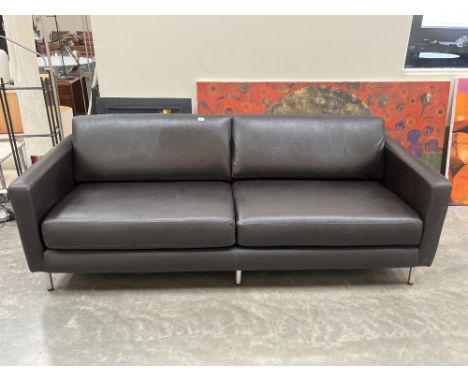 A contemporary style sofa upholstered in black leather. 88" wide.