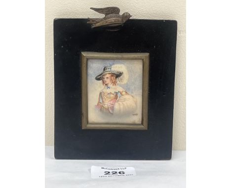 A 19th century portrait miniature of a lady in a wide brimmed hat with white plume. The ebonised frame 5" high.