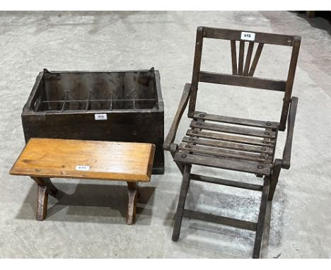 A vintage bottle crate; a folding child's chair and a stool.