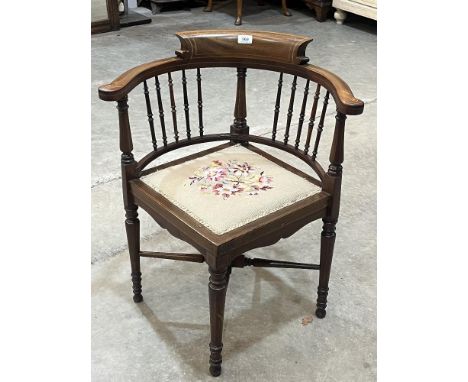 An Edward VII mahogany and line inlaid corner armchair with tapestry seat.