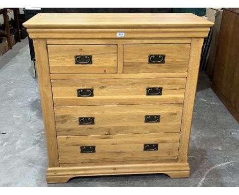 A light oak chest of drawers of recent manufacture. 39" wide.