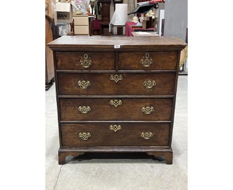 An 18th century oak chest of drawers raised on bracket feet. 37" wide.