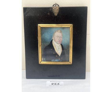 A 19th century portrait miniature of a gentleman in a black jacket and white stock. The ebonised frame 6½" high.