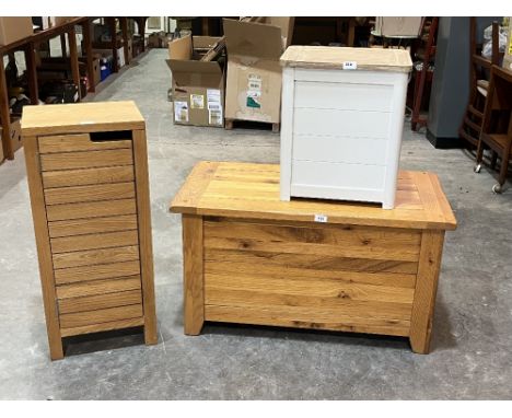 A light oak blanket chest, 36" wide; an oak cabinet and a linen basket. (3)