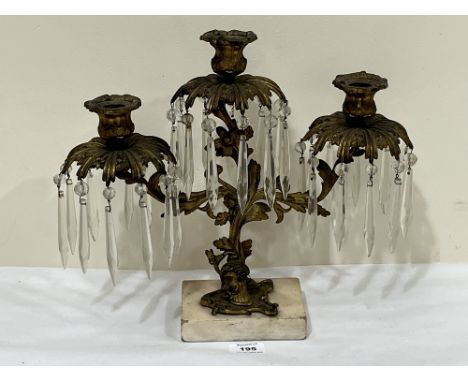 A 19th century ormolu three light lustre candelabrum hung with prismatic drops on marble base. 12¾" w x 15"h.