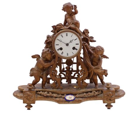 Zamak mantel clock with putti on top, on either side of the movement and on the pendulum, movement marked Japy Fils, front de