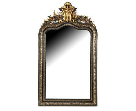 Ebonized wooden and gold-colored mirror with floral crest and richly decorated frame, Western Europe 19th century, 142x81 cm