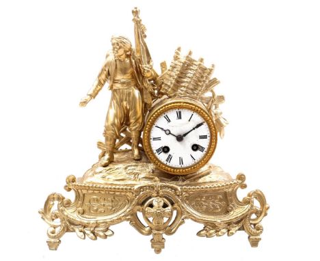 Classic gold-colored mantel clock of a man with a flag, 31 cm high