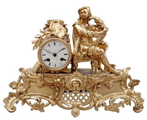 Classic gold-colored mantel clock with painter on top, 30 cm high