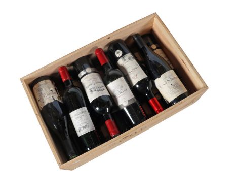 Crate with 12 bottles of red wine, mostly Bordeaux around 2005