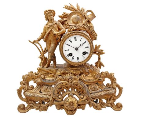 Zamak mantel clock with standing farm worker on the side clockwork and ears of corn with sickle and hat on top, 31 cm high, 3