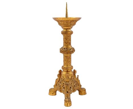 Brass pen candlestick with 3 seated statues of Saints at the base, standing on claw feet, in Gothic style, 56 cm high