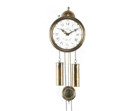 Round brass wall clock with enamelled dial on which the text Le Temps de Liege, with bell on top, 25 cm high