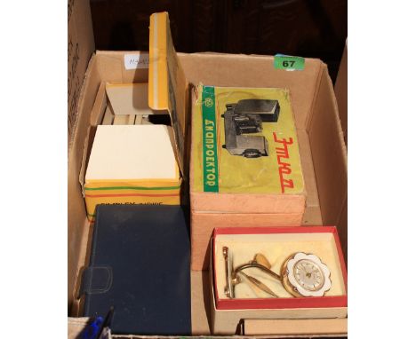 	A 1950's stereo viewer, slide projector, opera glasses etc.