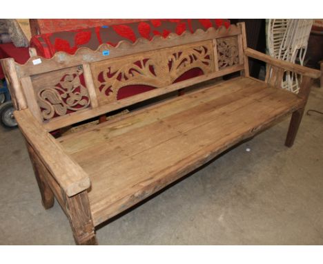	An Eastern bench with carved back. 74 w An Eastern bench with carved back. 74' wide"
