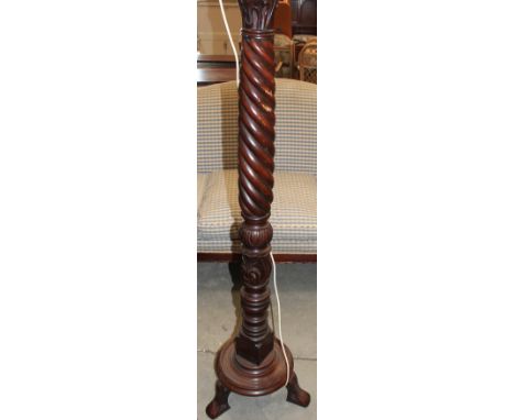 	A wrythen turned mahogany lamp standard