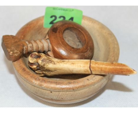 	A 19th Century circular nut cracker with a threaded bolt, a bone apple corer with initials WF and a turned bowl 4' diam.