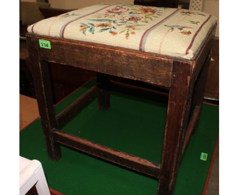 	A 19th Century oak stool with tapestry seat