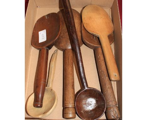 Four 19th Century treen kitchen spoons, a cawl spoon and a ladle