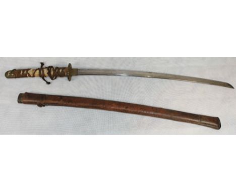 Edged weapons. A Japanese Samari sword with ray skin grip moulded tsuba and leather scabbard. Length of blade 24'. Second qua