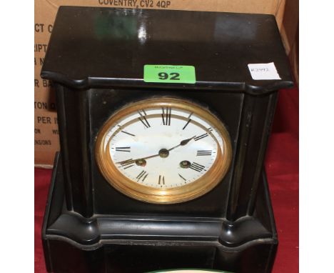 	A slate cased mantle clock