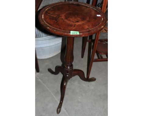 	A George III walnut tripod table with moulded top 14 ½' diam.