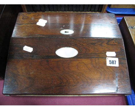 A XIX Century Rosewood Desk Tidy, with mother of pearl escutcheons, opens to reveal inset leather scriver and compartments. 