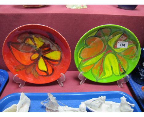 A Poole Red Delphis Dish, printed mark No. 3 and painted mark for Pamela Berans (1971- 2), another in green. (2)