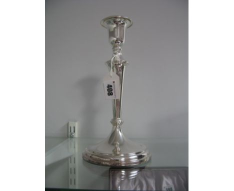 A Hallmarked Silver Candlestick, of plain tapering design, with removable nozzle, 25cm high (base weighted).