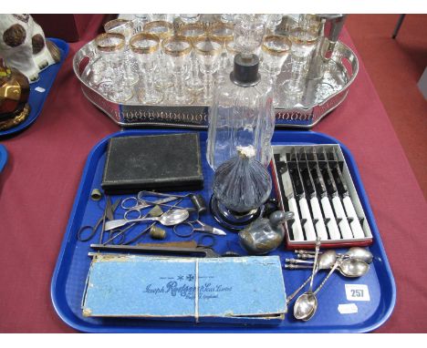 Decanter, cutlery, silver spoon, sugar tongs, glass oil lamp, duck trinket, etc:- One Tray