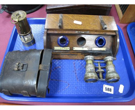 An Oak Desk Stand, with roll cover three apertures, two elongated pottery wheels (absent), stamped 'Criterion' to plated clip