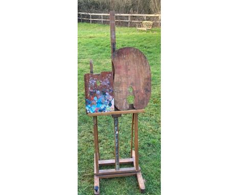 An early 20th cent artists easel and two palettes