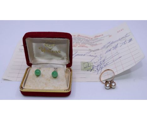 A pair of jade earrings, (w; 2.23g) together with an yellow metal and pearl ring, (w:3.95g) (2)