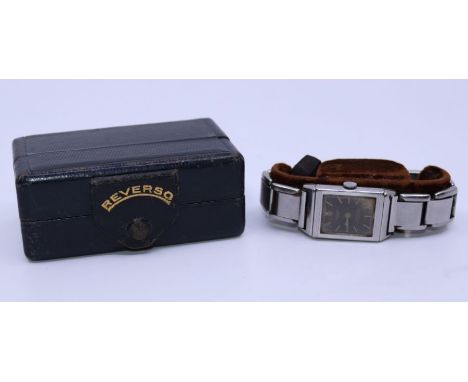 A Reverso Luxe stainless steel wristwatch, c.1930's, manual movement, cal.064, having signed black enamel rectangular dial wi