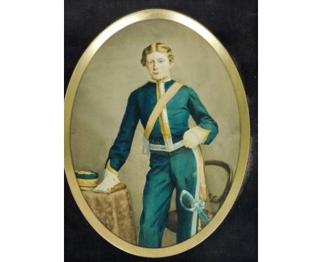 19thC School. Portrait of a young soldier, hand tinted photograph, 19cm x 14cm, in an oak frame.