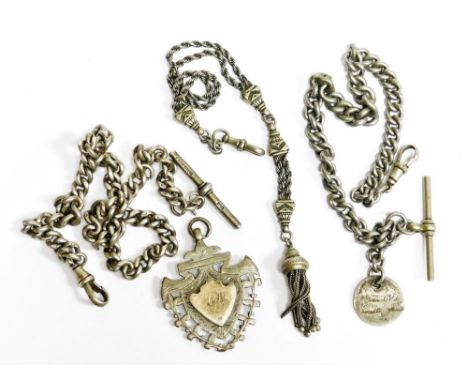 A silver watch chain, with T bar and clip clasp, a silver shield fob, a silver plated chain, and an Eastern style silver plat