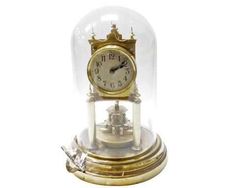 A 20thC Gustav Becker brass anniversary clock, with a glass dome, with key, 27cm high overall. 